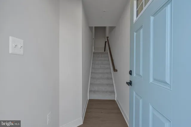 a view of a hallway with stairs