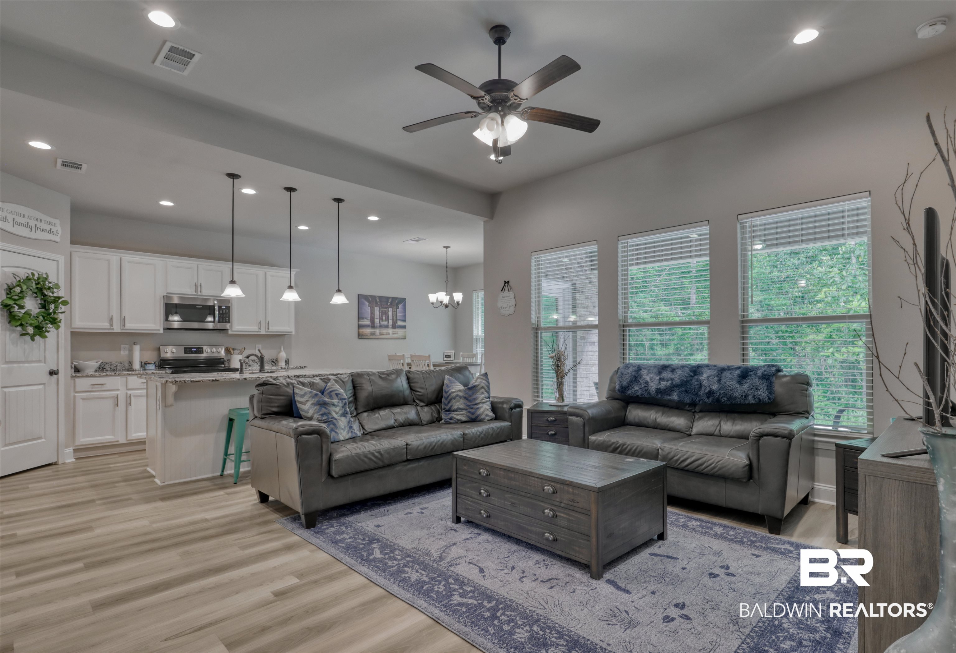 987 Gibson Court Foley, AL 36535 - Photo 7 of 34 Living room featuring recessed lighting, visible vents, light wood finished floors, and ceiling fan with notable chandelier