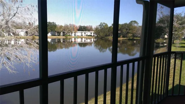 a view of a lake from a balcony