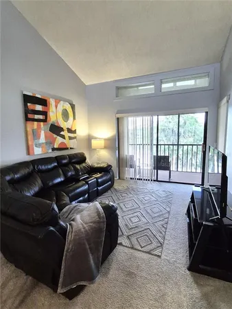 a bed room with a bed and a television