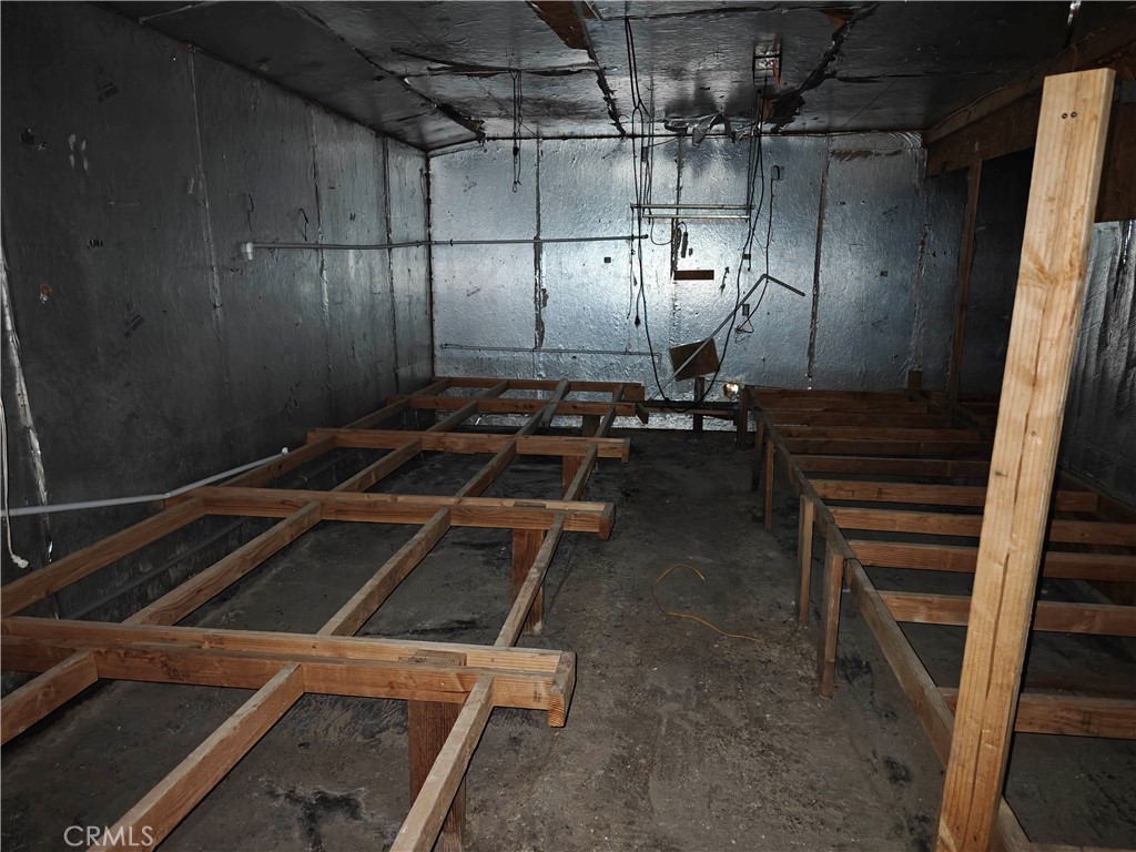 31576 Emerald Road Lucerne Valley, CA 92356 - Photo 11 of 44 a room with water heater and wooden cabinets