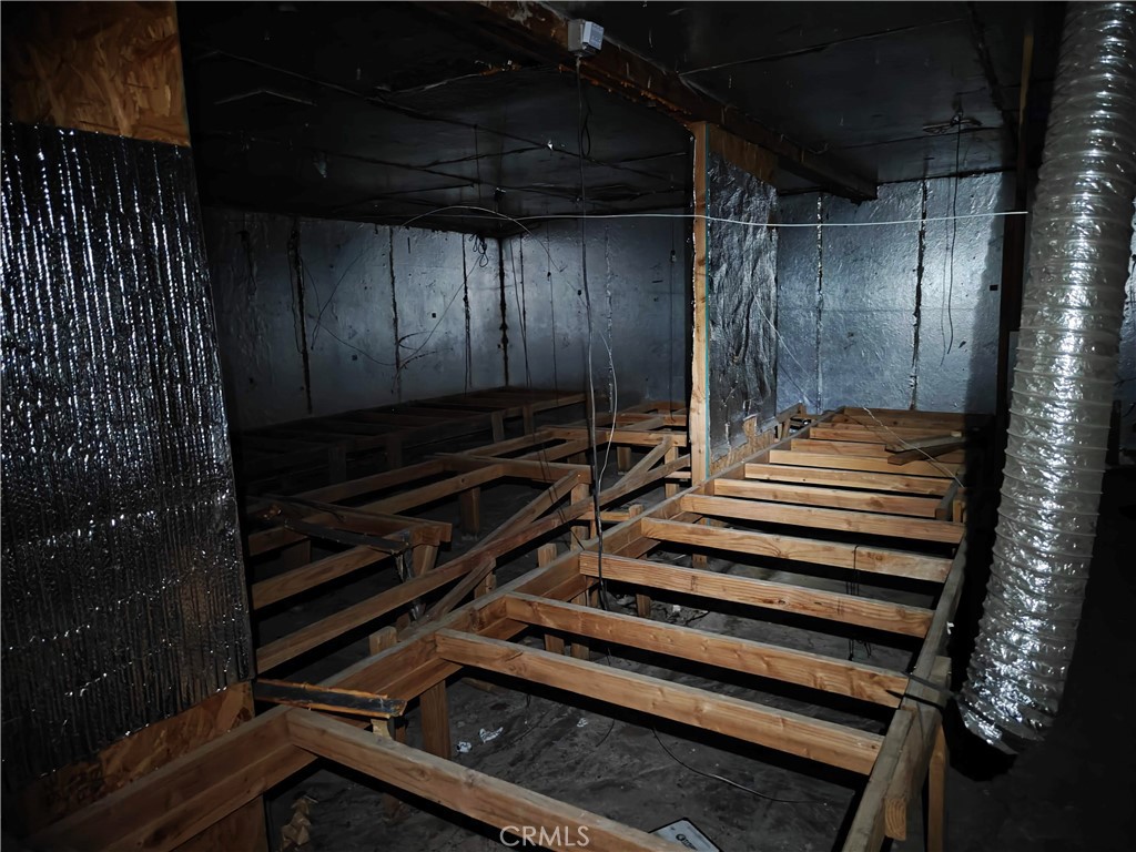 31576 Emerald Road Lucerne Valley, CA 92356 - Photo 15 of 44 a view of room with stairs and wooden floor