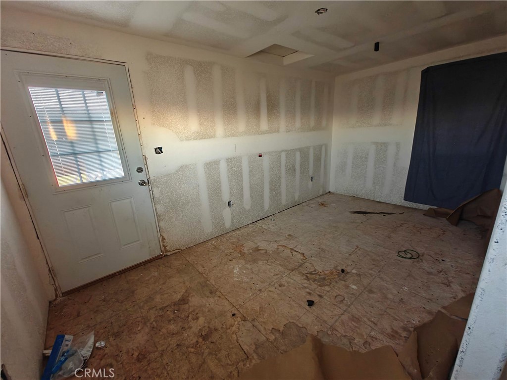 31576 Emerald Road Lucerne Valley, CA 92356 - Photo 9 of 44 an empty room with windows
