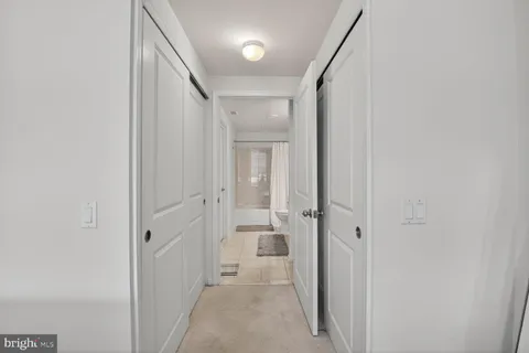 a bathroom with a sink toilet a mirror and shower