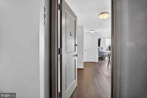 wooden floor with a bathroom