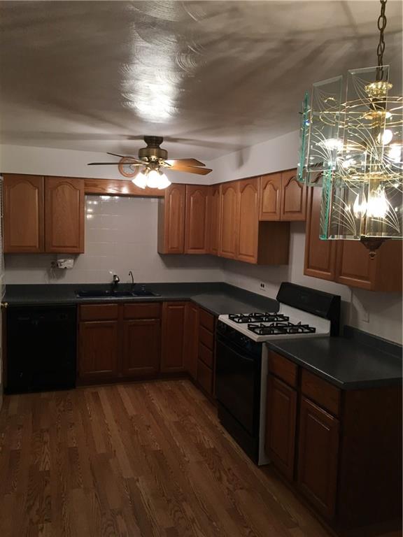52 East Union Road Cheswick, PA 15024 - Photo 3 of 15 a kitchen with granite countertop a stove and a refrigerator