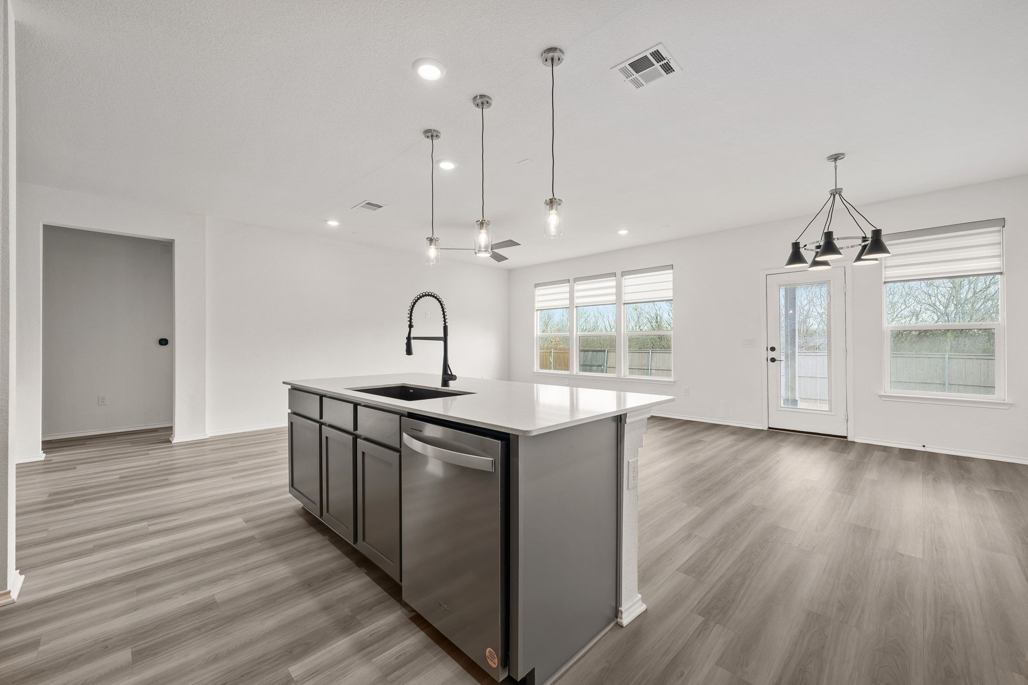 7715 Libretto Lane Austin, TX 78744 - Photo 39 of 39 The open concept floor plan making it easy to stay connected while working in the kitchen.