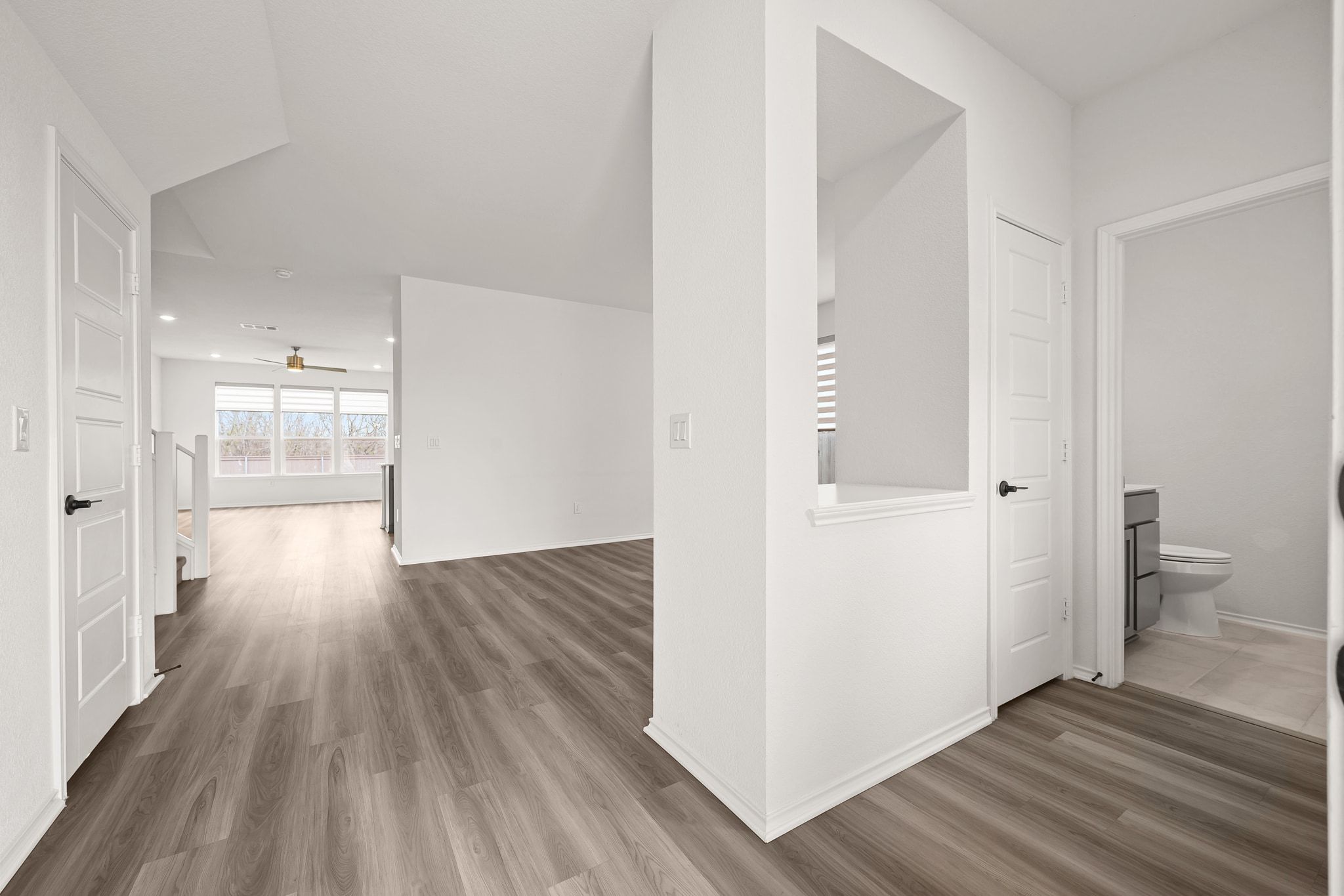 7715 Libretto Lane Austin, TX 78744 - Photo 11 of 39 The front entry opens into a bonus living or dining area with a coat closet and half bath to the right of the foyer.