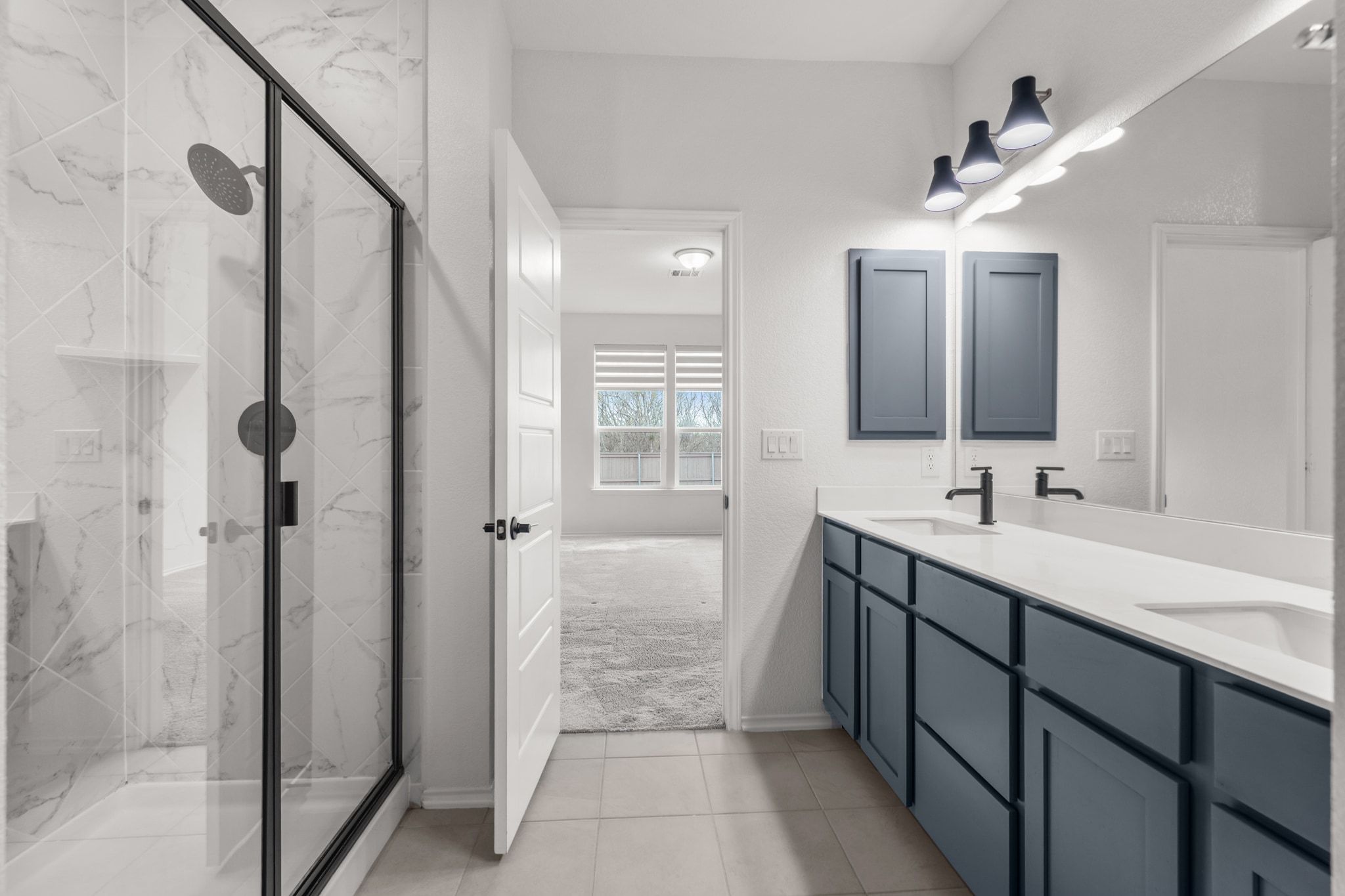 7715 Libretto Lane Austin, TX 78744 - Photo 16 of 39 The spa-inspired walk in shower features gorgeous designer tile backsplash.