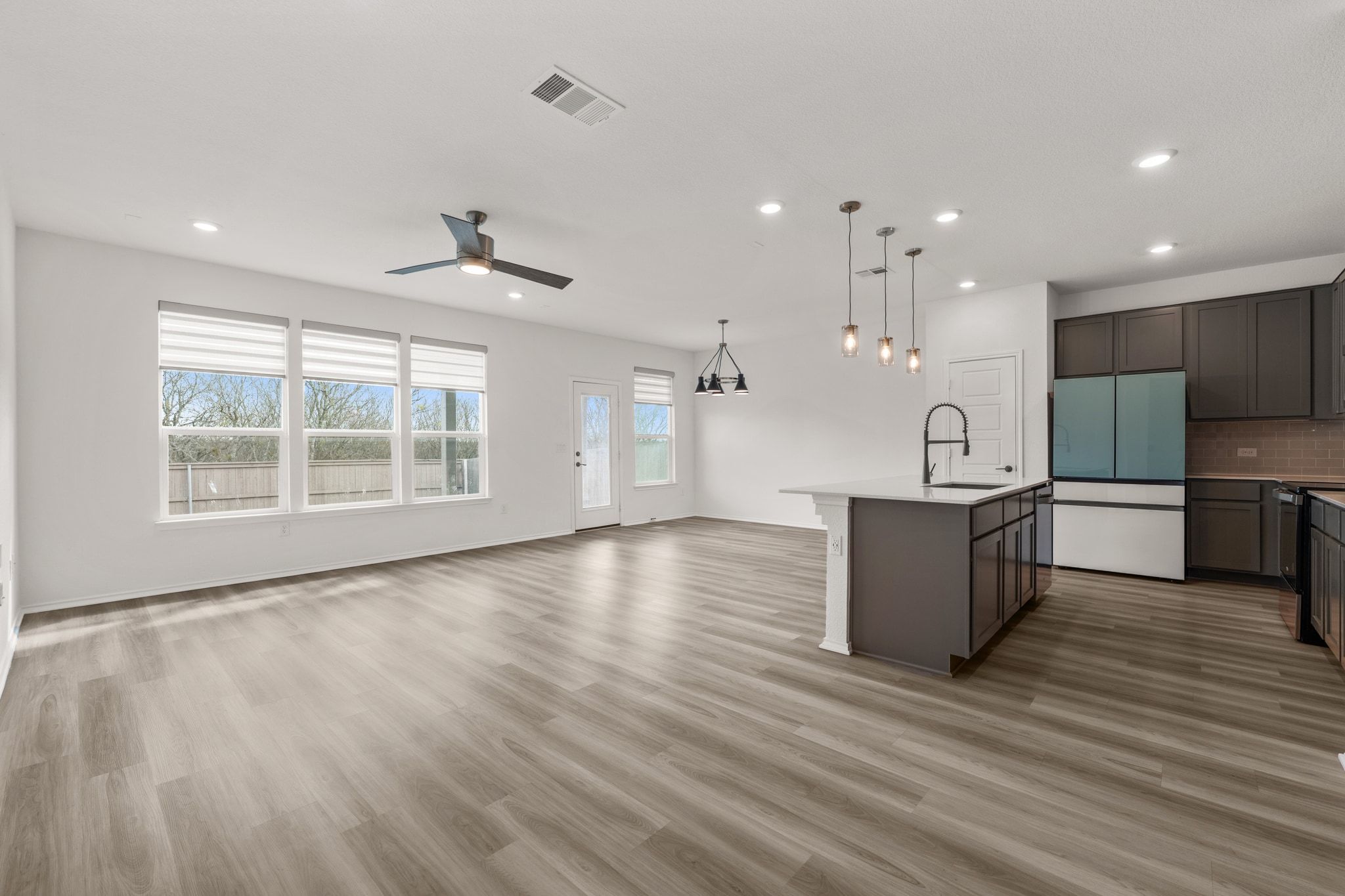 7715 Libretto Lane Austin, TX 78744 - Photo 2 of 39 Built in 2022, this well-maintained two-story home offers over 2,500 sq ft with 4 bedrooms, 2.5 baths, multiple living and dining areas, a covered porch, and a fenced backyard.