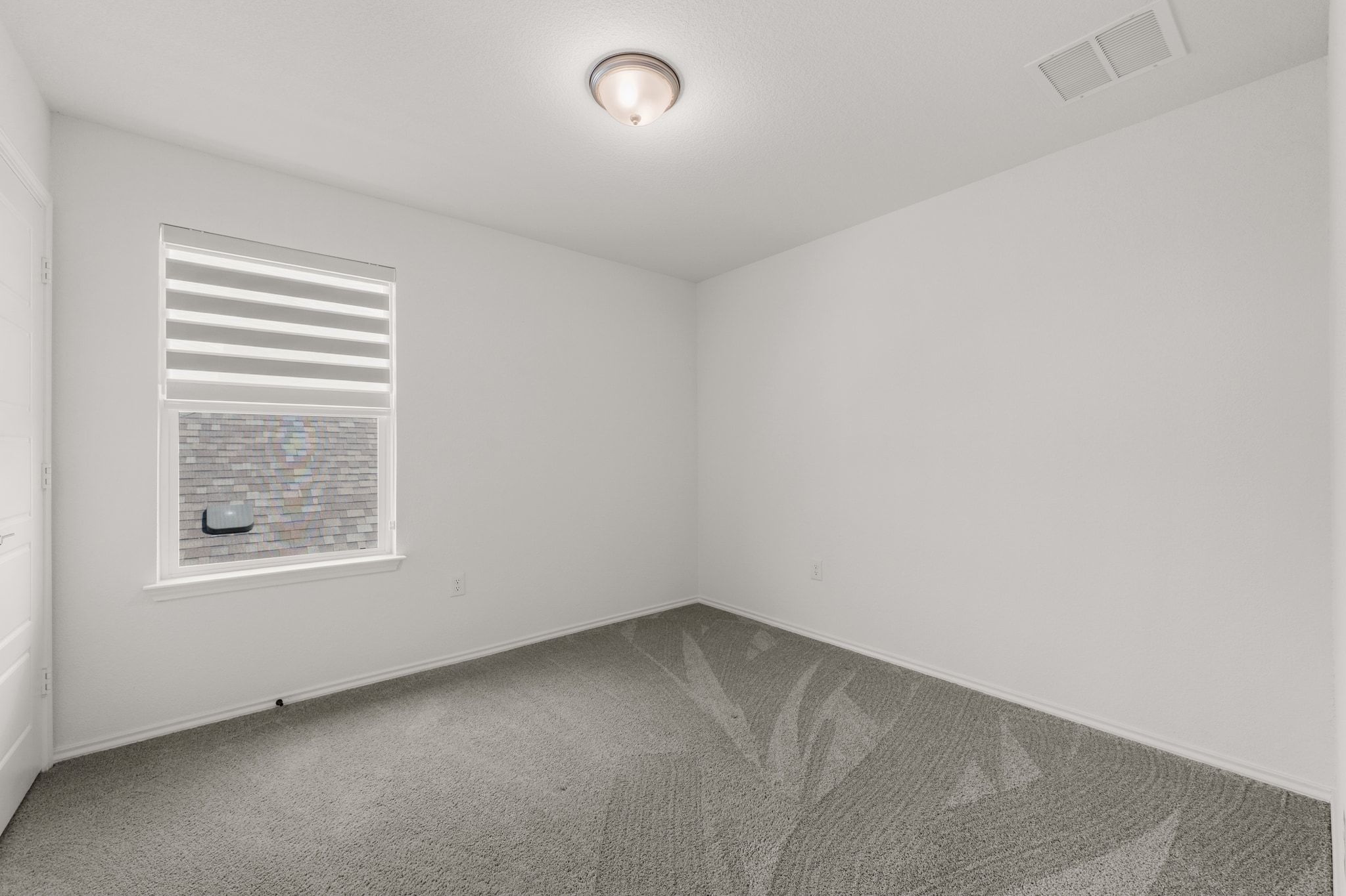 7715 Libretto Lane Austin, TX 78744 - Photo 23 of 39 All of the bedrooms come with tall ceilings, windows, closet storage and a light fixture that you can swap out for fans or chandeliers at your leisure.