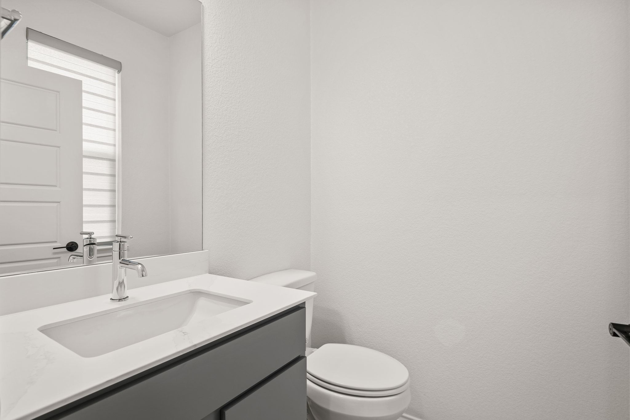 7715 Libretto Lane Austin, TX 78744 - Photo 26 of 39 There's also a main floor guest powder room.