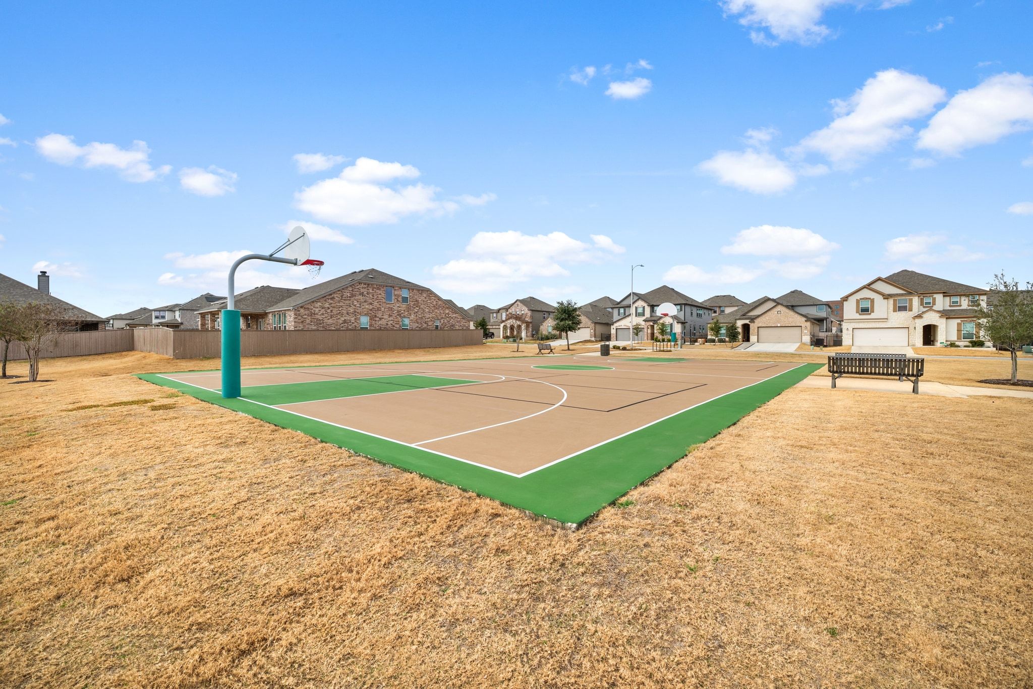 7715 Libretto Lane Austin, TX 78744 - Photo 34 of 39 There's also a beautiful sports court surrounded by wide open park space.