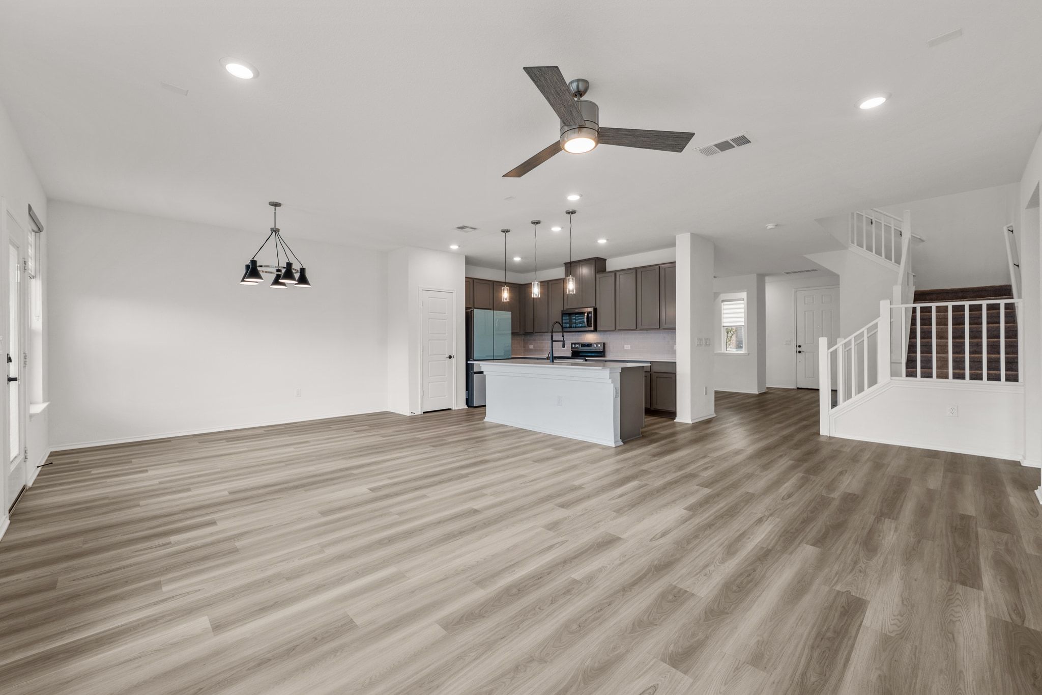 7715 Libretto Lane Austin, TX 78744 - Photo 37 of 39 The entryway leads past the formal dining room into a bright and spacious open concept floor plan.