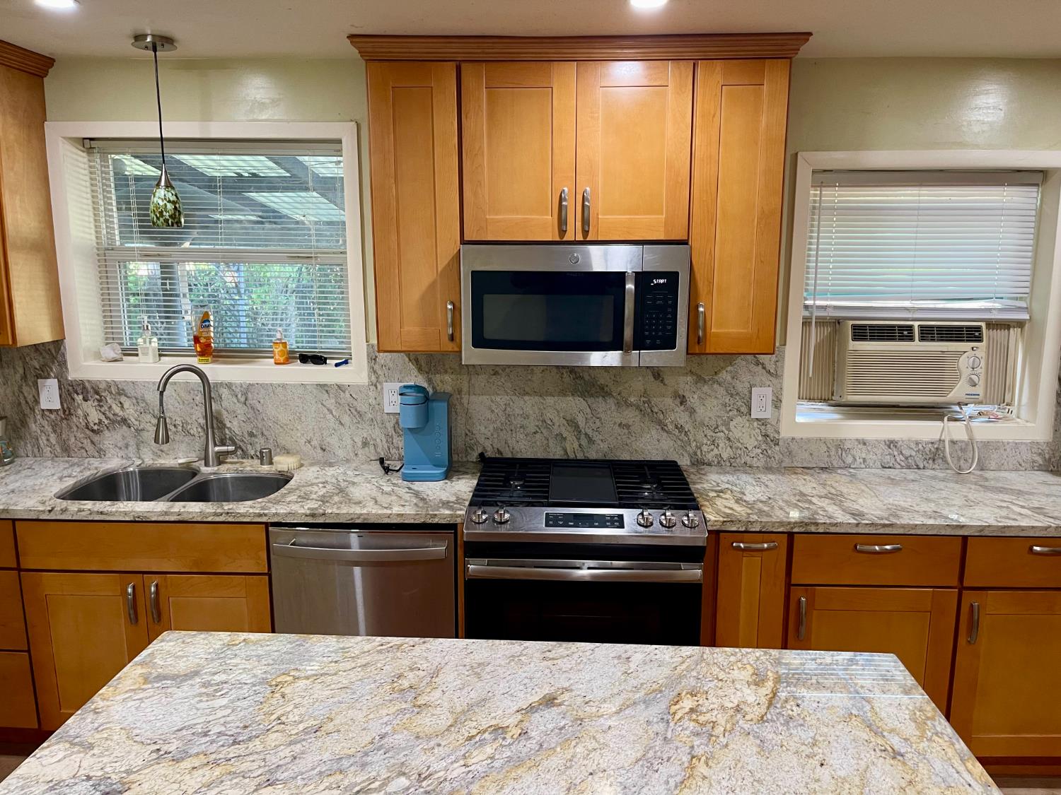 1736 6th Street Concord, CA 94519 - Photo 11 of 64 a kitchen with stainless steel appliances granite countertop a stove a sink and a microwave
