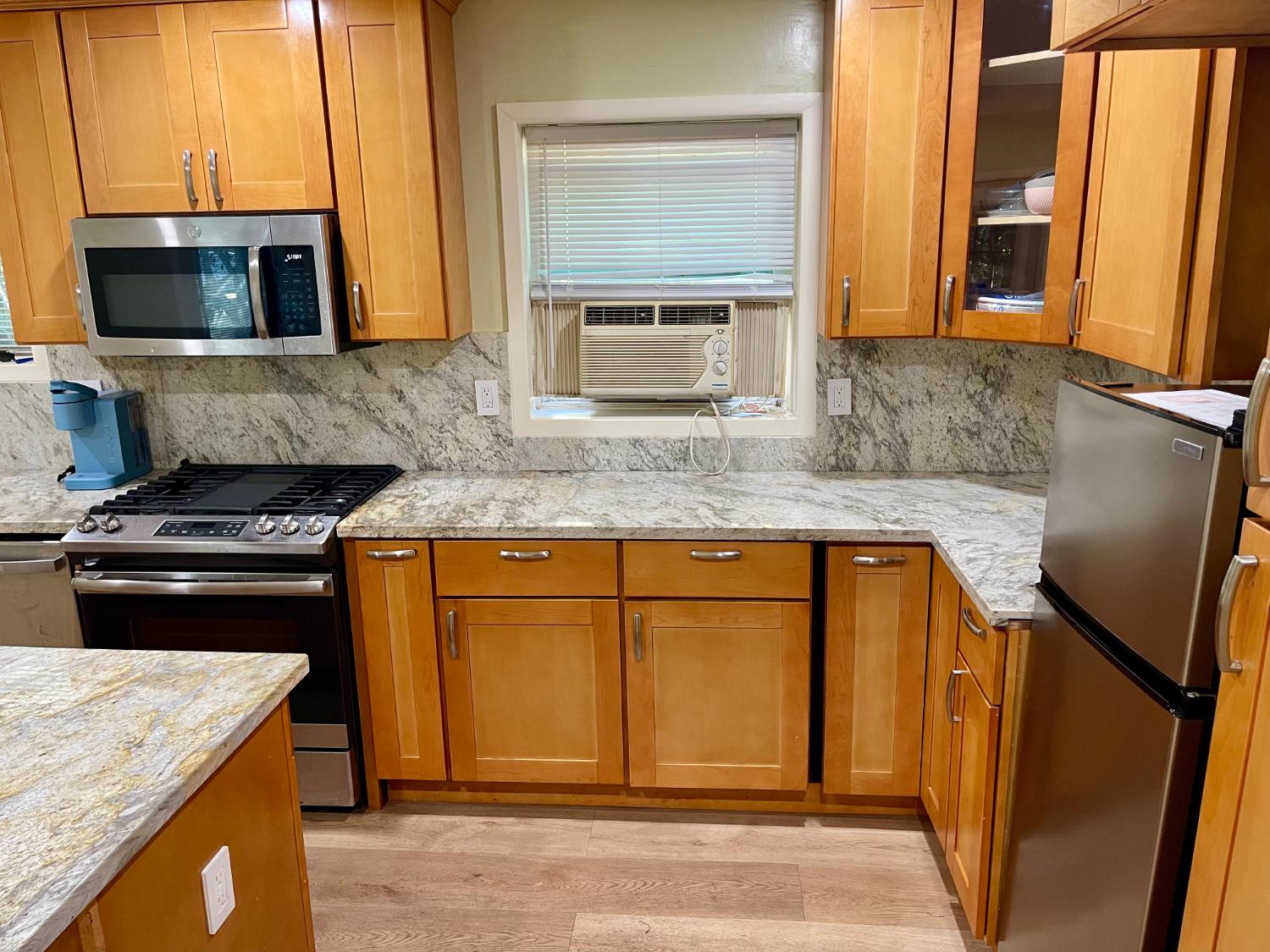 1736 6th Street Concord, CA 94519 - Photo 15 of 64 a kitchen with granite countertop stainless steel appliances and wooden cabinets