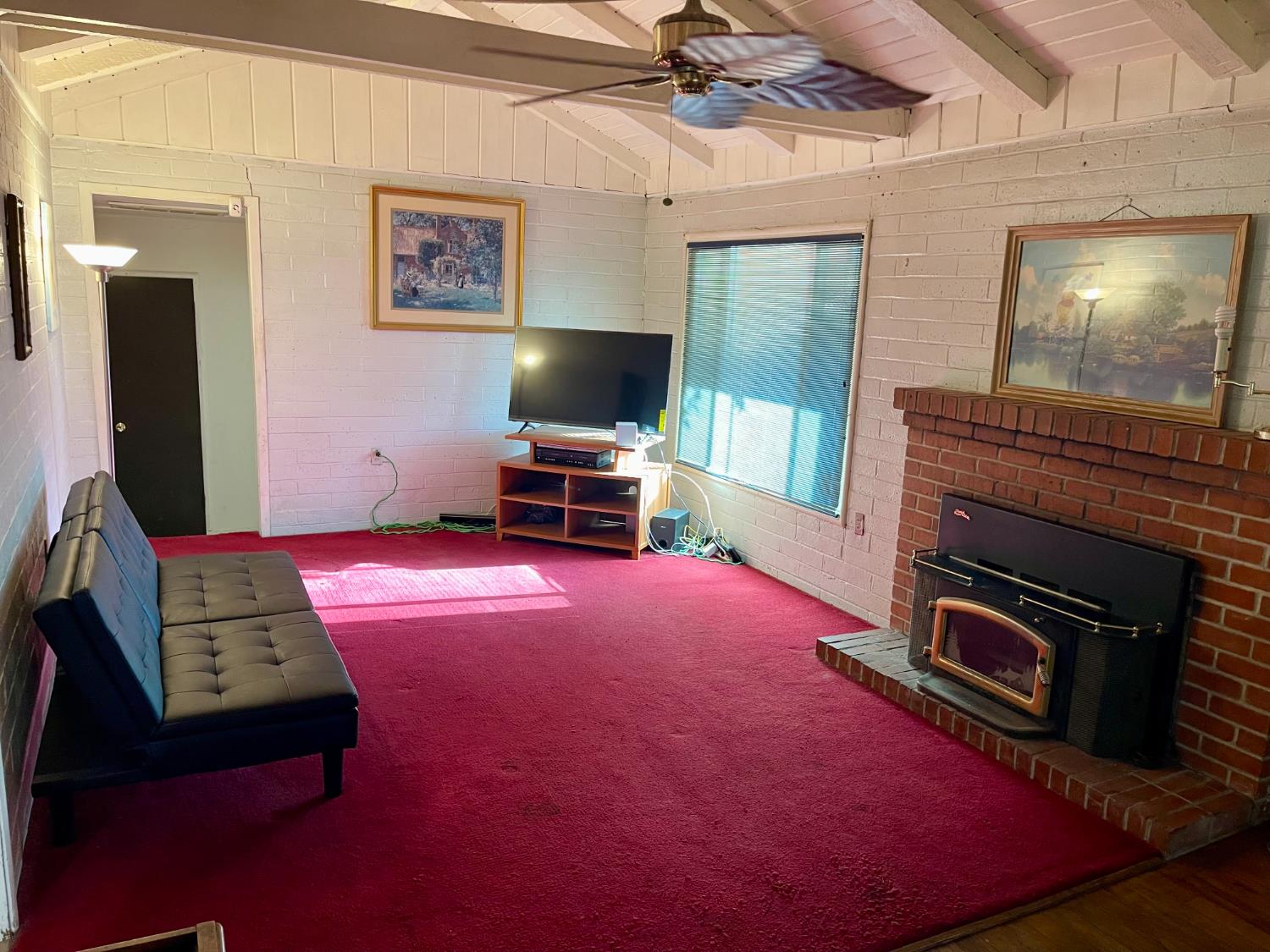 1736 6th Street Concord, CA 94519 - Photo 18 of 64 a living room with furniture a flat screen tv and a fireplace
