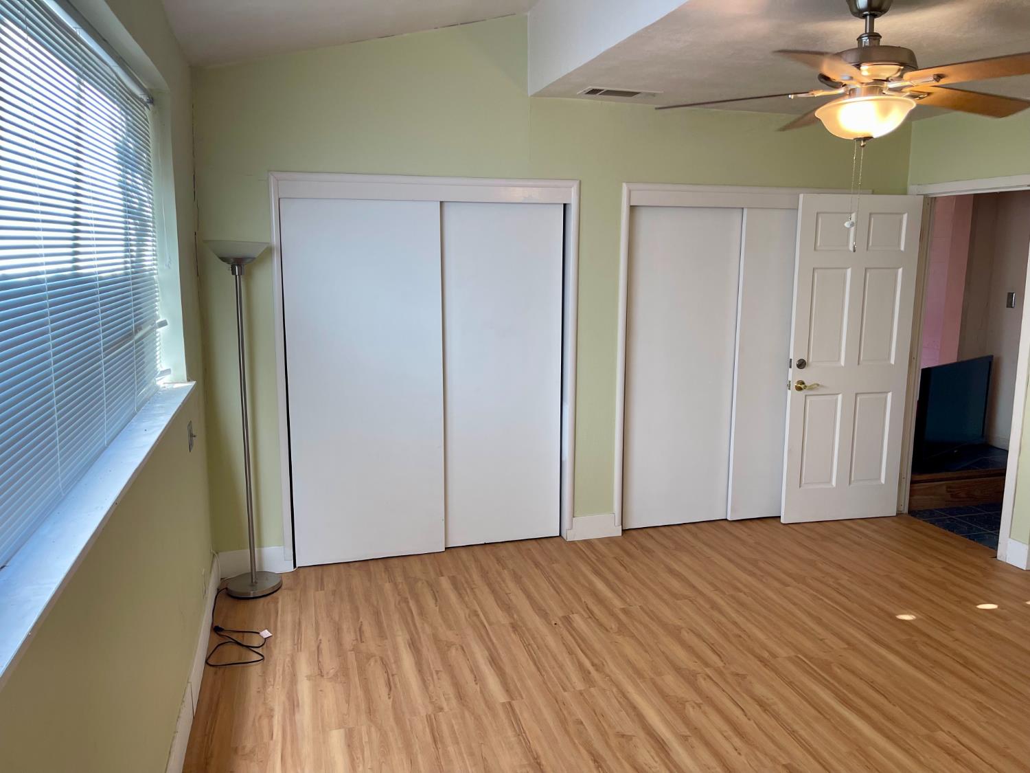 1736 6th Street Concord, CA 94519 - Photo 36 of 64 a view of empty room with wooden floor and fan