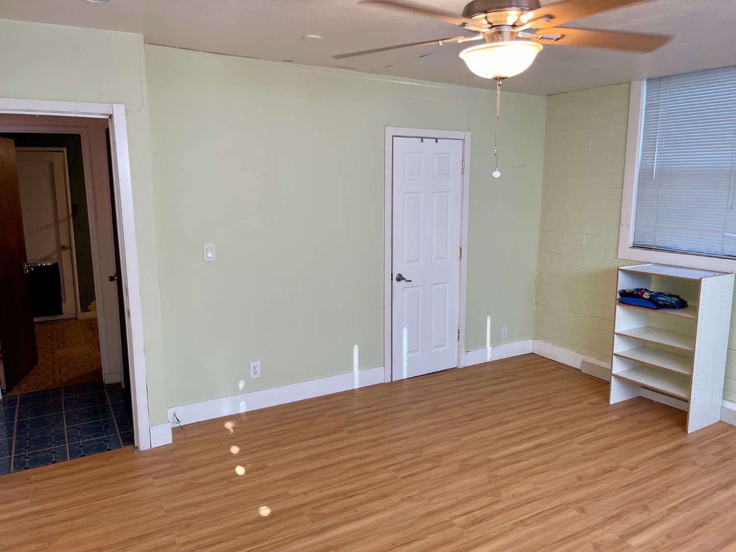 1736 6th Street Concord, CA 94519 - Photo 37 of 64 a view of an empty room with wooden floor and a window
