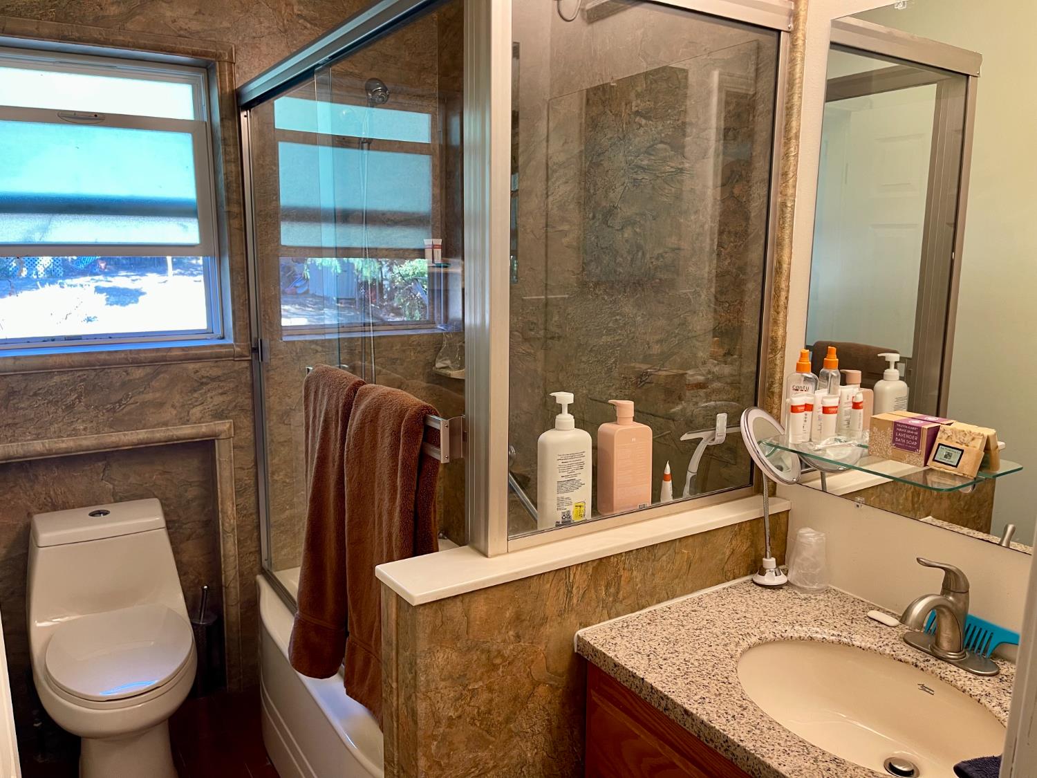 1736 6th Street Concord, CA 94519 - Photo 40 of 64 a bathroom with a granite countertop sink and a mirror
