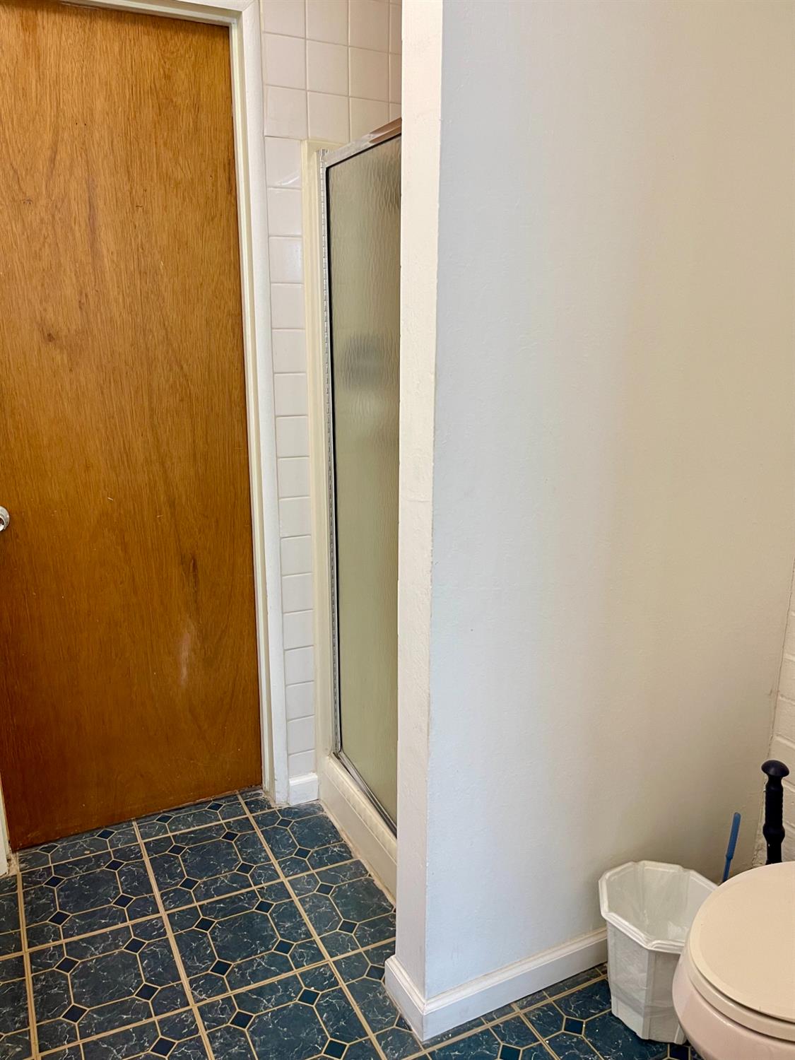 1736 6th Street Concord, CA 94519 - Photo 44 of 64 a bathroom with a toilet and a shower