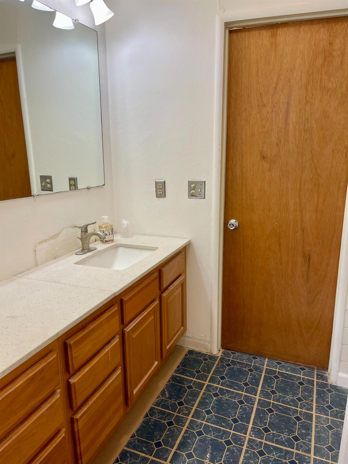 1736 6th Street Concord, CA 94519 - Photo 45 of 64 a bathroom with a sink and a mirror