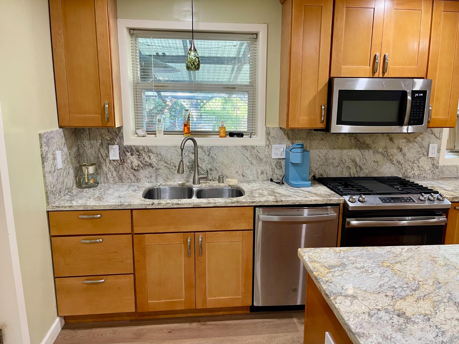 1736 6th Street Concord, CA 94519 - Photo 10 of 64 a kitchen with stainless steel appliances granite countertop a sink and a stove