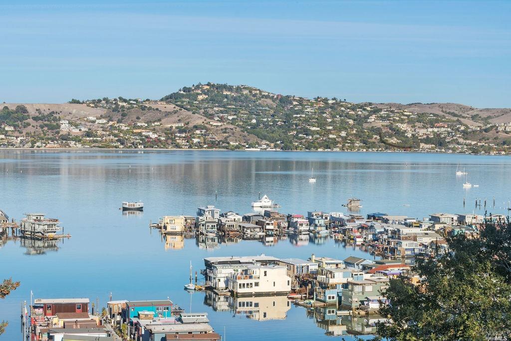 an aerial view of a house with a lake view