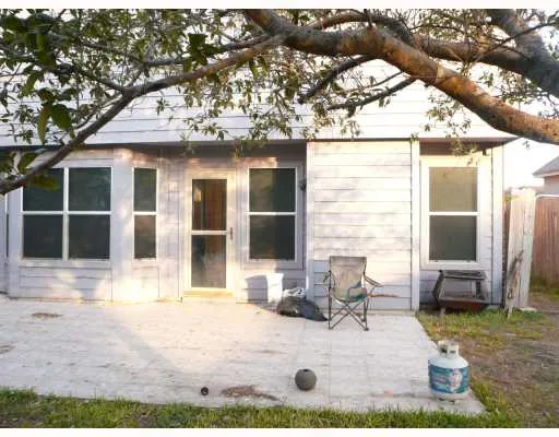 a view of house with backyard space and patio