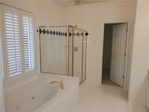 3715 Ridgeside Court Suwanee, GA 30024 - Photo 24 of 33 a bathroom with a bathtub and a shower