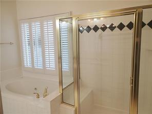 3715 Ridgeside Court Suwanee, GA 30024 - Photo 25 of 33 a bathroom with a bathtub and shower