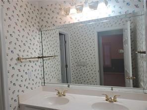 3715 Ridgeside Court Suwanee, GA 30024 - Photo 27 of 33 a bathroom with a sink and a mirror