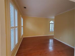 3715 Ridgeside Court Suwanee, GA 30024 - Photo 3 of 33 a view of a room with wooden floor and a window