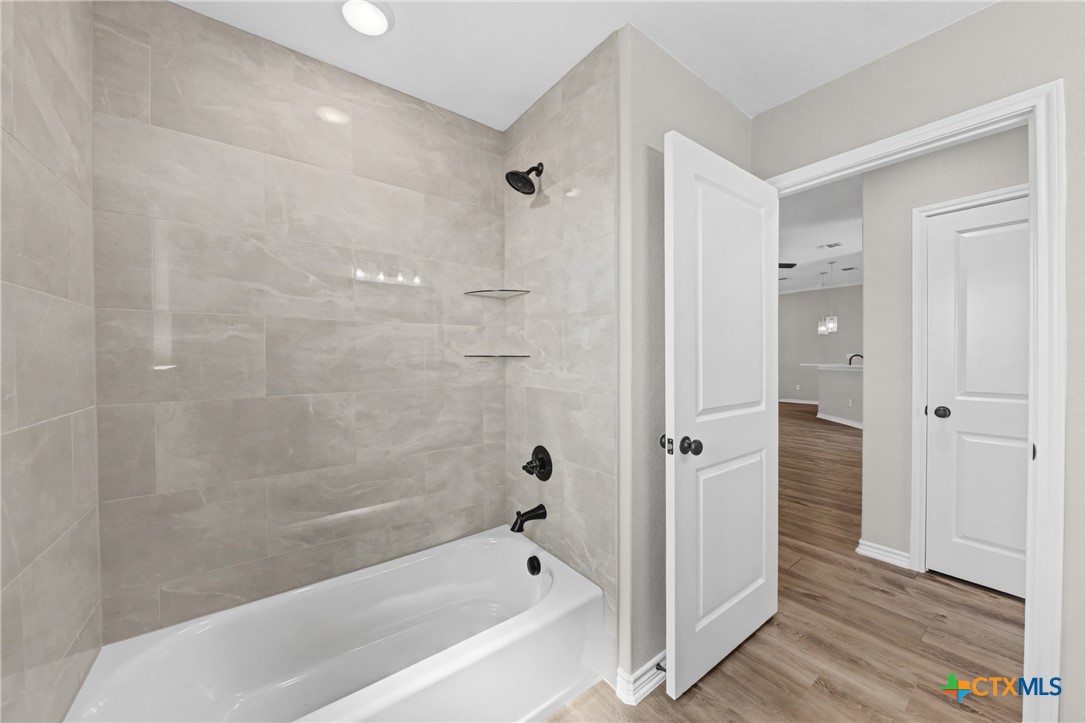 604 Magnolia Drive Troy, TX 76579 - Photo 20 of 33 a bathroom with a bathtub with shower