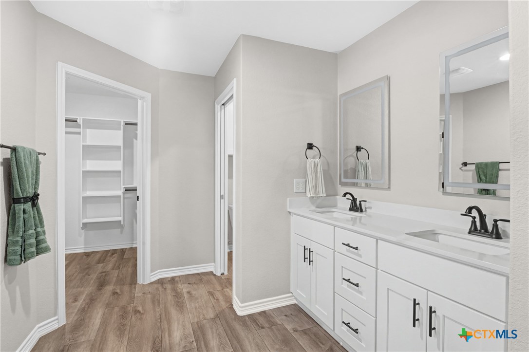 604 Magnolia Drive Troy, TX 76579 - Photo 25 of 33 a spacious bathroom with double sink and a mirror