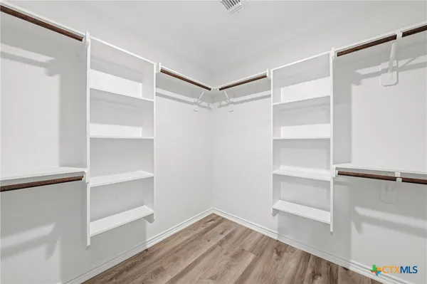 a view of room with hardwood floor