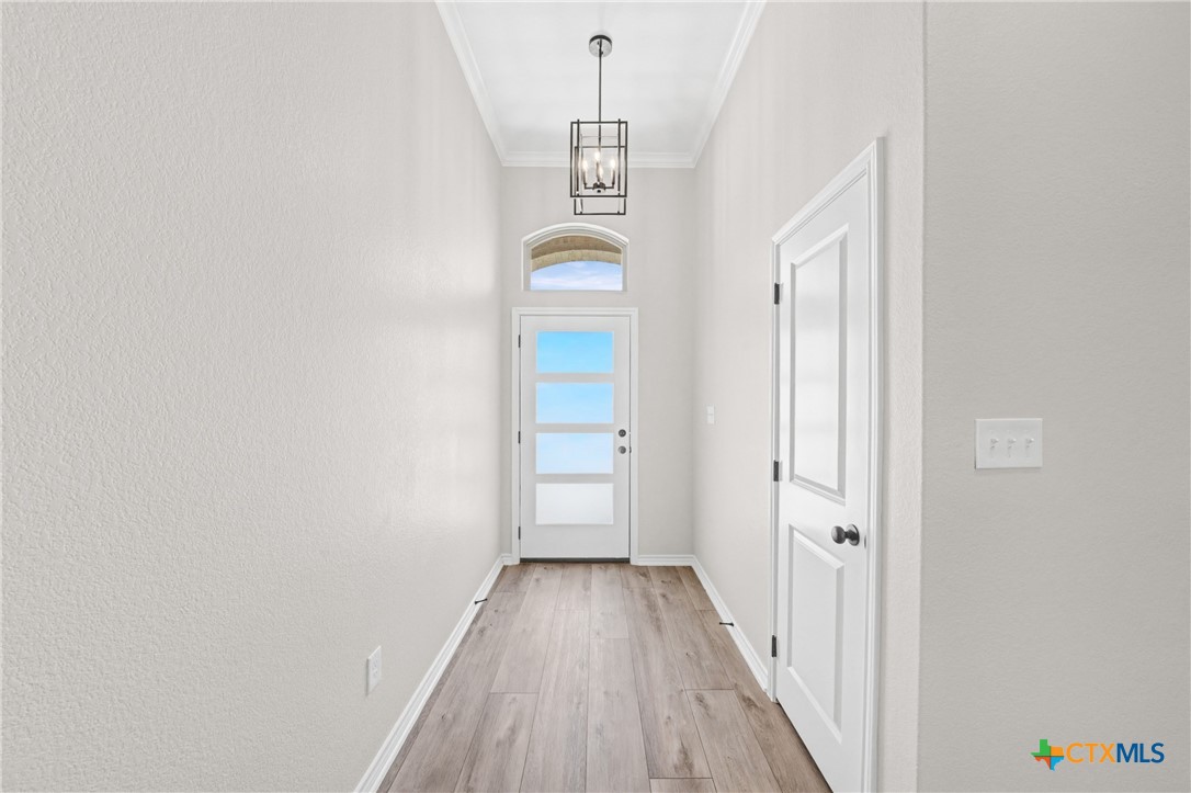 604 Magnolia Drive Troy, TX 76579 - Photo 4 of 33 a view of a hallway with wooden floor