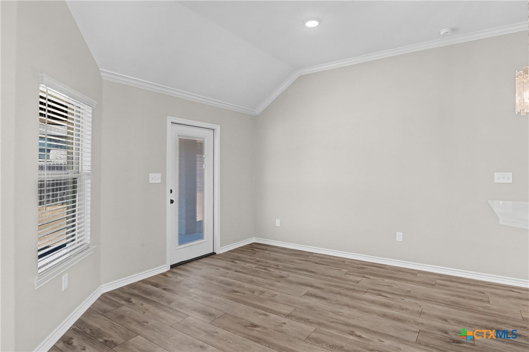 604 Magnolia Drive Troy, TX 76579 - Photo 8 of 33 a view of an empty room with wooden floor and a window