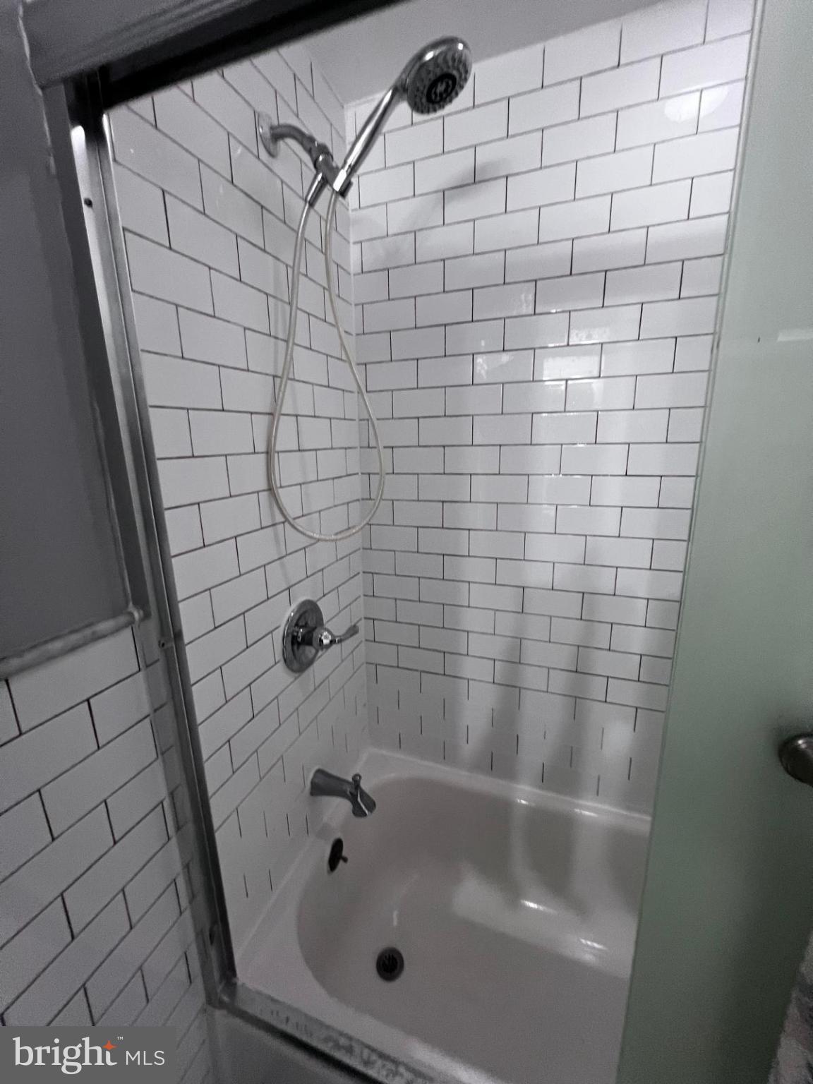Sleek shower with modern tile design.