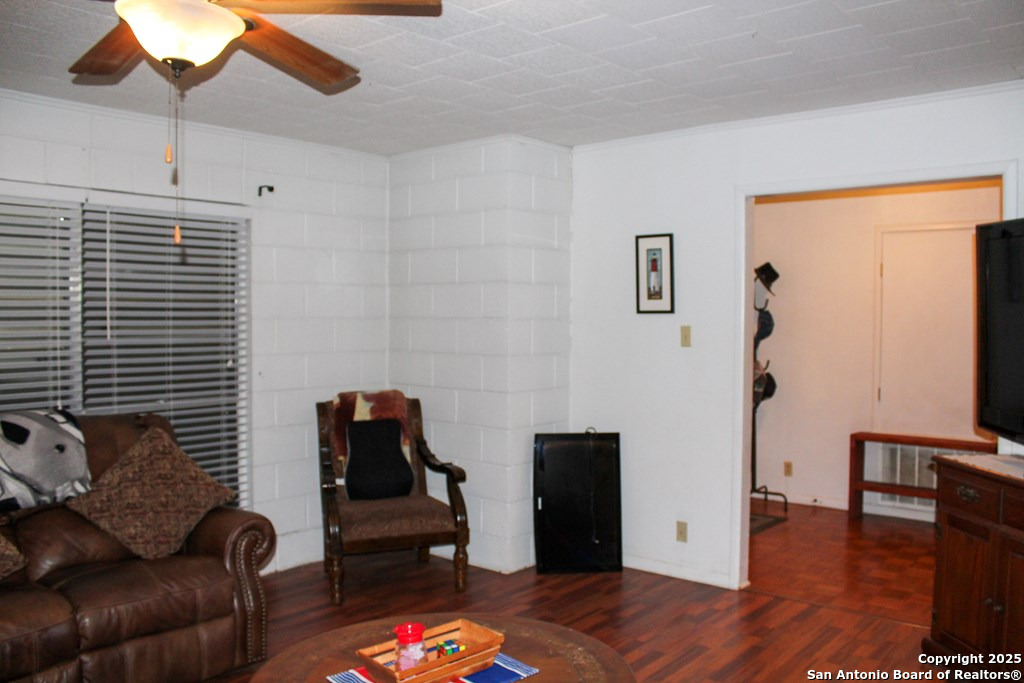 102 Holman Road Lake City, TX 78368 - Photo 14 of 27 a living room with furniture and wooden floor