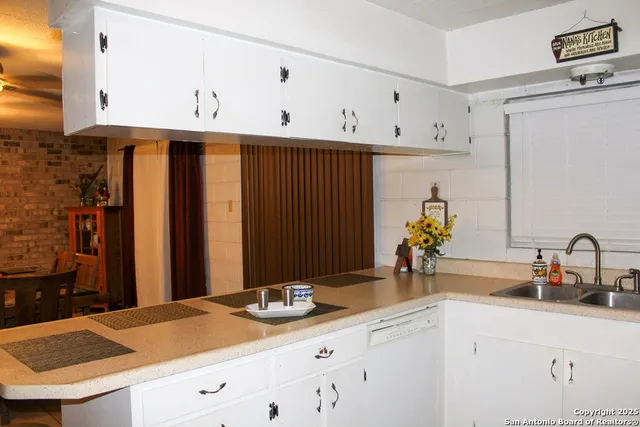 a kitchen with cabinets and sink