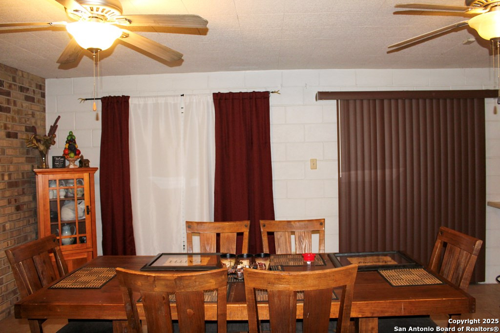 102 Holman Road Lake City, TX 78368 - Photo 22 of 27 a living room with furniture and a chandelier
