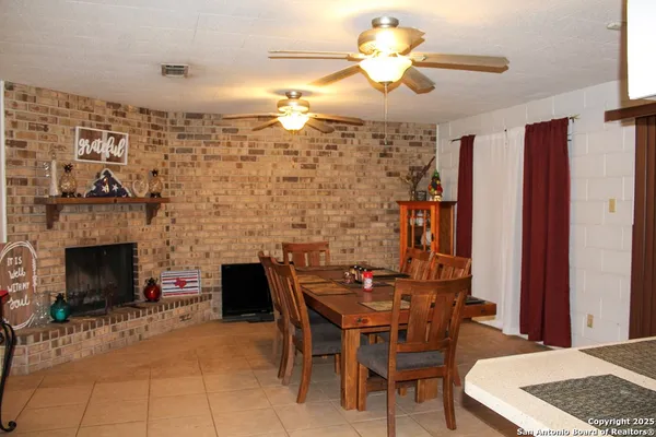 a dining room with furniture and window