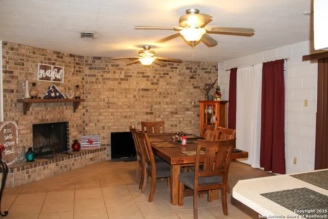 a dining room with furniture and window