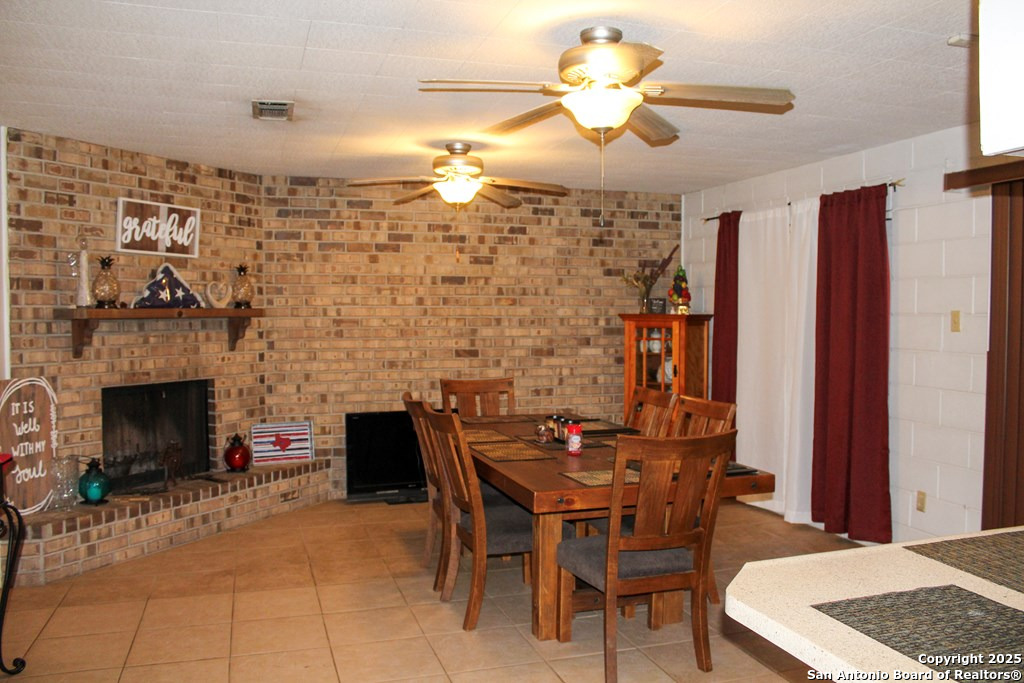 102 Holman Road Lake City, TX 78368 - Photo 25 of 27 a dining room with furniture and window