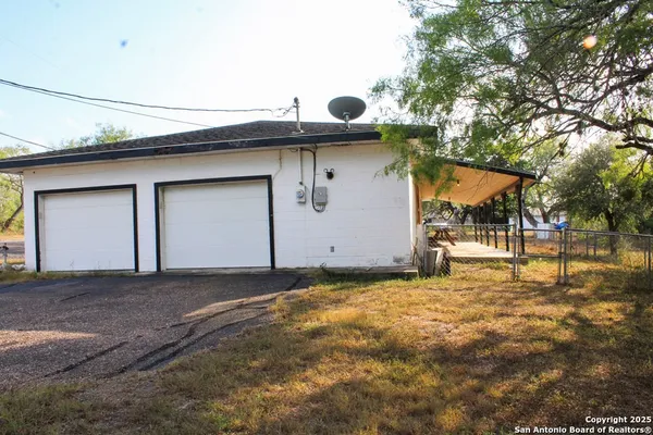 a front view of house with garage