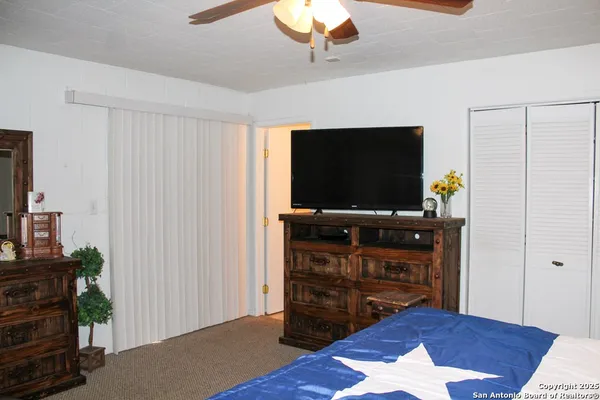 a room with furniture and flat screen tv