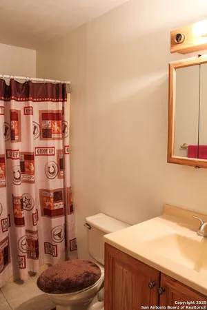 a bathroom with a toilet and a sink