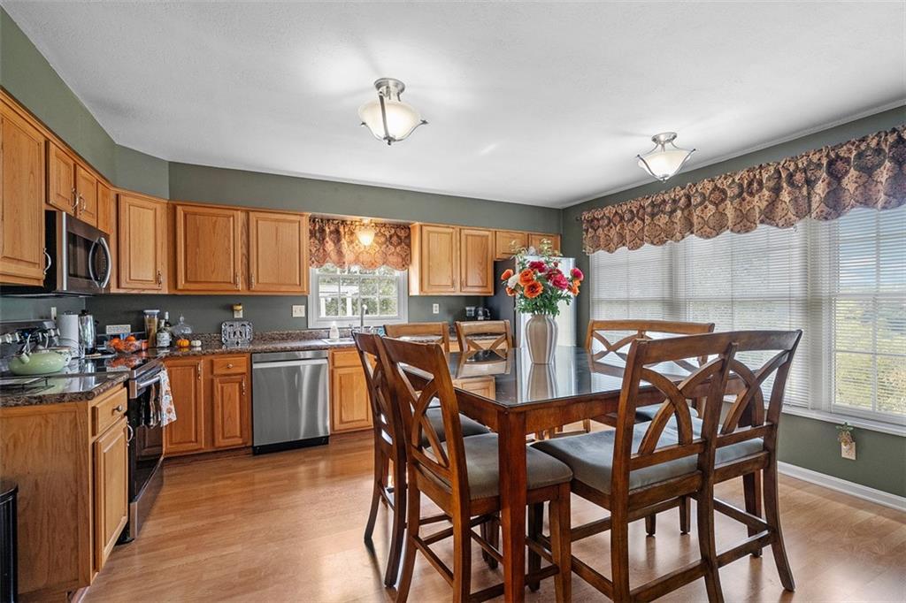 247 Randy Lane Coraopolis, PA 15108 - Photo 13 of 39 a view of a dining room with furniture and chandelier