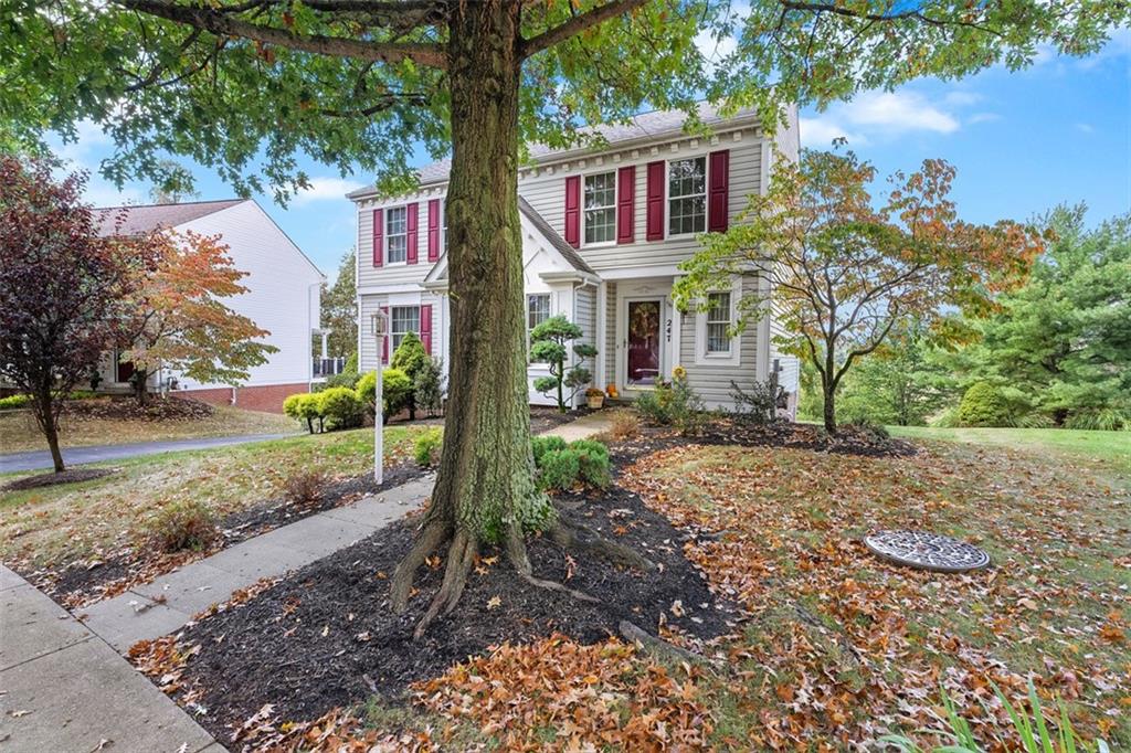 247 Randy Lane Coraopolis, PA 15108 - Photo 2 of 39 a view of a yard in front of a house with large trees